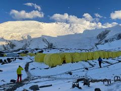 03B The tents of Ak-Sai Travel Lenin Peak Camp 1 4400m after a snowfall with Lenin Peak and the moon beyond in the late afternoon